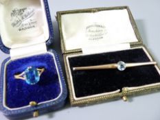 TWO ITEMS OF BLUE STONE SET GOLD JEWELLERY to include a possibly 22ct gold and facet cut topaz ring,
