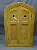 AN OAK GOTHIC STYLE RECESS WALL CUPBOARD, dual twin panel doors opening to reveal interior shelves