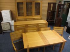 A FABULOUS MODERN DINING SUITE - light oak comprising extending dining table, four ladder back