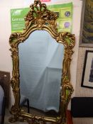 FINE GILTWOOD WALL MIRROR, the frame is attractive leather and floral scrolling, overall size 125