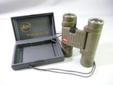 A PAIR OF GREEN LEITZ TRINOVID BINOCULARS in hard plastic case
