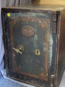 A VINTAGE S WITHERS & CO CAST IRON SAFE WITH KEY, having painted detail and hand grip handle,