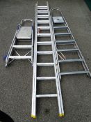 AN EXTENDING ALUMINIUM LADDER and two sets of step ladders, 5.1m open, the extender