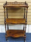 A FINE WALNUT THREE SHELF ANTIQUE WHATNOT with carved galleried top, galleried rail