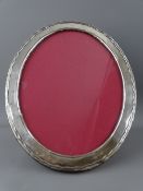 SILVER PEDESTAL OVAL PHOTOGRAPH FRAME Birmingham 1902, 24 x 19cms