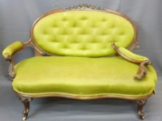WALNUT FRAMED SOFA with oval button backed upholstery with intricate carving and similar spoon-