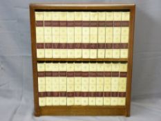 MAHOGANY BOOKCASE containing a selection of twenty four Britannia Encyclopaedia
