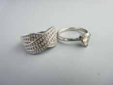 TWO 18CT WHITE GOLD DIAMOND SET RINGS to include 0.54ct pear shape engagement ring, size Mid M-N and