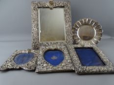 THREE PIERCED SILVER PHOTOGRAPH FRAMES, a similar easel mirror, 29.5 x 22.5cms Birmingham 1848,