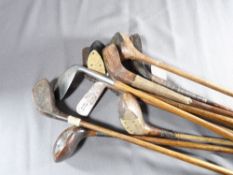 ELEVEN ANTIQUE GOLF CLUBS - all wooden handled, being four irons and seven woods in various