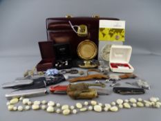 BURGUNDY TRAVELLING VANITY CASE WITH KEY containing a mixed quantity of jewellery, wristwatches,