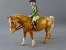 BESWICK MODEL OF A PALOMINO WITH GREEN JACKET RIDER and black Beswick back stamp, 13.5cms height,