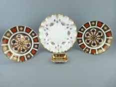 FOUR PIECES OF ROYAL CROWN DERBY BONE CHINA, two 21.5cms diameter plates, a 9cms wide '1128' pin