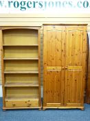 MODERN PINE FURNITURE - a two door wardrobe and an open shelf bookcase with base drawer
