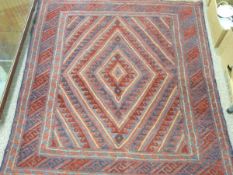 CAZUK RUG - red ground with central diamond ripple pattern and triple bordered edge, 128 x 116cms