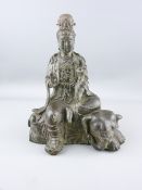 CHINESE CAST BRONZE FIGURINE OF GUANYIN seated upon an elephant holding a lotus flower sceptre,