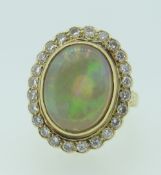 18CT YELLOW GOLD OPAL & DIAMOND CLUSTER RING the opal measuring 1.1 x 1.4cms approx., 9.2grams