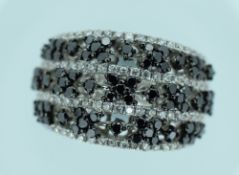 18CT WHITE GOLD DIAMOND RING featuring seventy-three round brilliant cut black diamond (1.01ct