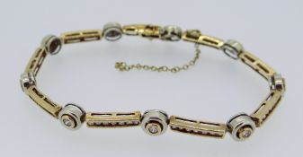 9CT YELLOW GOLD DIAMOND SET BRACELET of circular and bar design, 20cms long, 14.1grams approx.