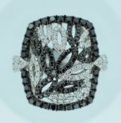 18CT WHITE GOLD DIAMOND RING featuring 105 round brilliant cut black diamonds (1.15ct TDW) with