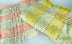 TWO WELSH WOOLEN BLANKETS both check pattern, one mainly green and yellow, the other green and pink