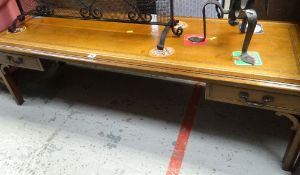 REPRODUCTION LEATHER TOOLED-TOP COFFEE TABLE of long and narrow proportions with single and false