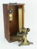 VICTORIAN WOODEN CASED BRASS MICROSCOPE BY NEWTON & CO. with three auxiliary lenses
