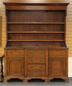 NORTH WALES BREAK FRONT OAK WELSH DRESSER having a base of four centre drawers, pair of flanking