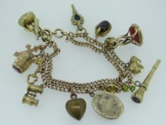 9CT YELLOW GOLD DOUBLE FLAT LINK CURB CHARM BRACELET having assorted charms to include cricket bat