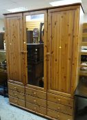 PINE EFFECT TRIPLE WARDROBE with mirrored centre door and nine drawer base