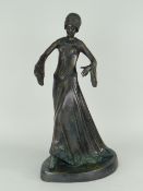 BRONZE STATUE OF A LADY IN FLOWING DRESS, 46cms high