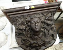 WOODEN CARVED VICTORIAN WALL DECORATION of a female's face surrounded by lilies, 44 x 53cms