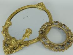 GILT WOOD ROCOCO STYLE OVAL WALL MIRROR with twin-sconce base, 56cms high, together with an openwork