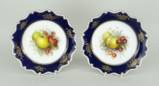 PAIR OF ROYAL WORCESTER PORCELAIN DISPLAY PLATES, the interiors painted with fruit by Richard