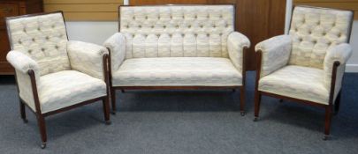 AN ANTIQUE THREE PIECE MAHOGANY FRAMED SUITE in multi-coloured flecked upholstery and with button