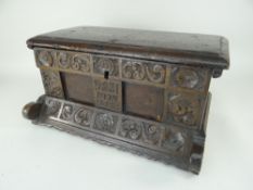 INTERESTING ANTIQUE CARVED OAK BOX, deep carved rosette and scrolls and centre panel initialled