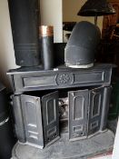 SUBSTANTIAL BLACK PAINTED CAST IRON FIRE with bi-folding doors Provenance: S A Brain & Co Ltd (