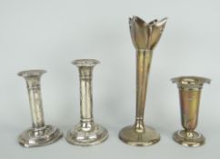 PAIR OF SILVER (LOADED) CYLINDRICAL CANDLESTICKS, together with two other silver (loaded) single