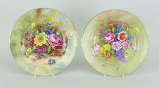 PAIR OF ROYAL WORCESTER FLORAL DECORATED PLATES signed by E Barker and Freeman respectively, both