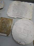 THREE VICTORIAN PLASTER PLAQUES, one of a female's head, the other a roundel with castle to the