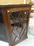 ANTIQUE MAHOGANY HANGING CORNER CUPBOARD with astragal glazed door, 104cms tall
