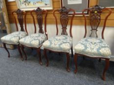 A SET OF FOUR EDWARDIAN CARVED LYRE BACK DRAWING ROOM CHAIRS