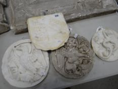 FOUR VICTORIAN PLASTER MAQUETTE ROUNDELS, one heraldic coat of arms, 25cms another a pelican,