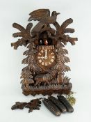 BLACK FOREST CARVED CUCKOO CLOCK featuring stag and rotating figures, complete with original