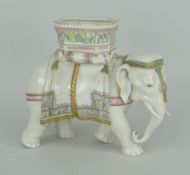 ROYAL WORCESTER PORCELAIN IVORY GLAZED INDIAN DOMESTIC ELEPHANT, the howdah decorated in gaudy