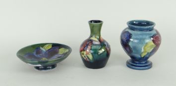 THREE ITEMS OF MOORCROFT 'HIBISCUS' including a small decorated pin dish and two small vases