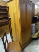 A MODERN PINE EFFECT TWO DOOR WARDROBE, 175 x 80cms, together with an oak farmhouse chair and a