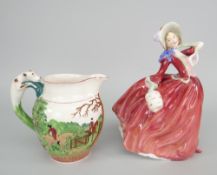 ROYAL DOULTON FIGURINE 'Autumn Breezes', together with a Wedgwood John Peel hunting jug