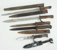 FIVE LATE VICTORIAN / EARLY 20TH CENTURY MILITARY BAYONETS, four with scabbards and including a