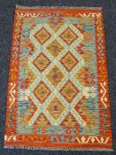 VEGETABLE DYED WOOL CHOBI KELIM RUNNER in rust and orange ground geometric pattern, 150 x 102cms